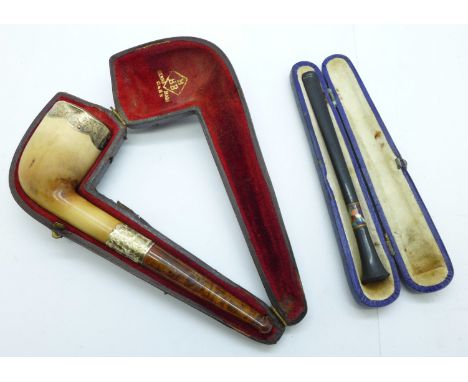 A cheroot holder and a pipe with silver embellishments, both cased 