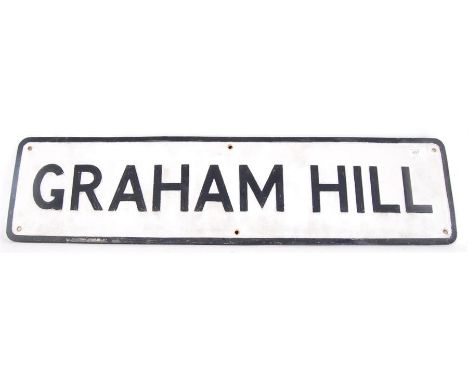 An original vintage cast iron painted road sign for ' Graham Hill ' 92cm wide x 23cm high. Raised black text, with makers mar