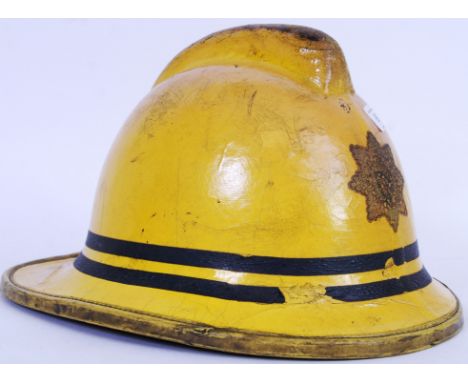 An original 1990's issue (1992) Fireman's uniform helmet, in yellow.&nbsp;POSTAGE: Worldwide postage / delivery available on 