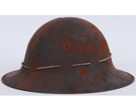 An original WWII Second World War tin helmet, with original liner. The inside with impressed ' M ' mark. Size 7.&nbsp;POSTAGE