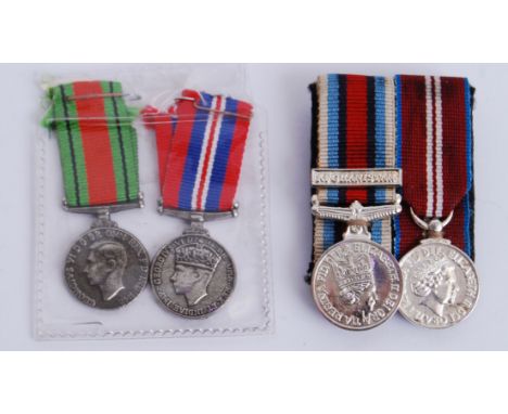 A collection of miniature medals to include a WWI pair and a later Afghanistan pair.&nbsp;POSTAGE: Worldwide postage / delive