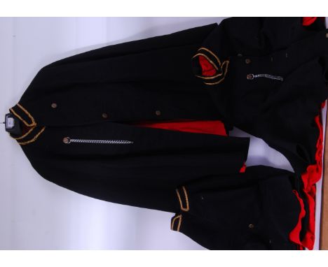 A collection of three vintage Police uniform capes, all with gold coloured braid to the collars, fleur de lys brass buttons a