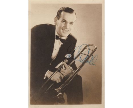 MILLER GLENN: (1904-1944) American Jazz Musician and Bandleader. Vintage signed sepia 5 x 7 photograph of Miller in a three-q