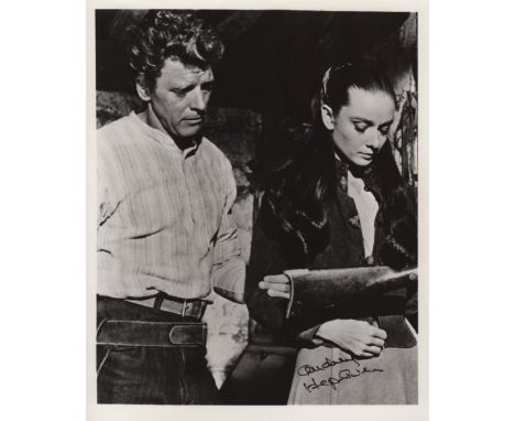  HEPBURN AUDREY: (1929-1993) Belgian-born Actress, Academy Award winner. Signed 8 x 10 photograph of Hepburn standing in a th
