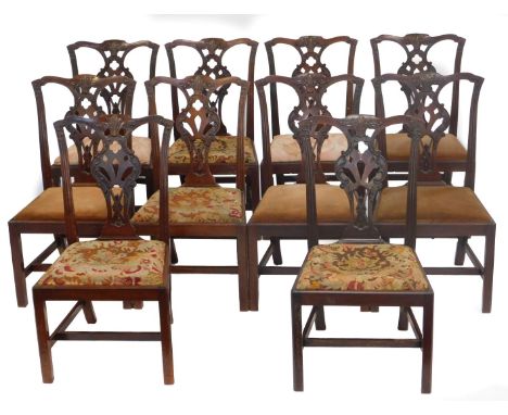 A set of ten Chippendale style mahogany dining chairs, each with a drop in seat of differing design, raised on square legs un