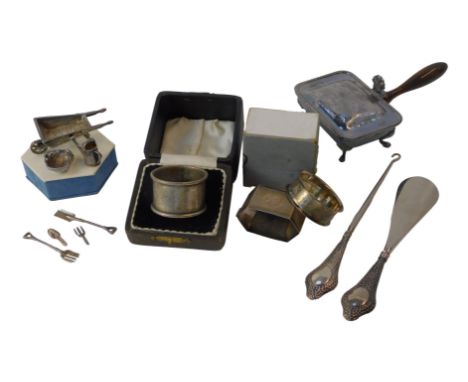 A group of silver and silver plated wares, comprising three silver napkin rings, each with engine turned decoration, a Victor