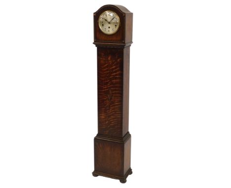 An early 20thC oak cased grandmother clock, the circular silvered dial bearing Arabic numerals, eight day movement with Westm