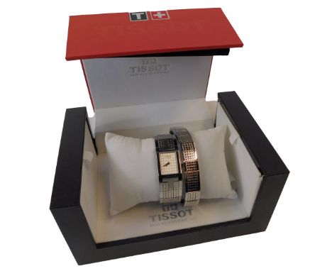 A Tissot watch set, on a stainless steel strap with rectangular white finish dial, and matching bracelet with additional link