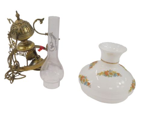 An early 20thC brass gasolier oil lamp, converted to electricity, with shade and chimney.