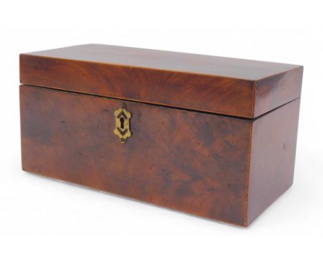 A Georgian flame mahogany and boxwood line inlaid tea caddy, of rectangular form, the hinged lid enclosing a recess for a tea