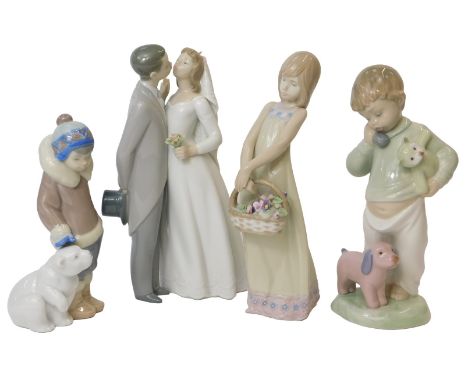 A group of Lladro and Nao porcelain, comprising Lladro Eskimo and polar bear cub figure group, 16cm high, boxed, Lladro groom