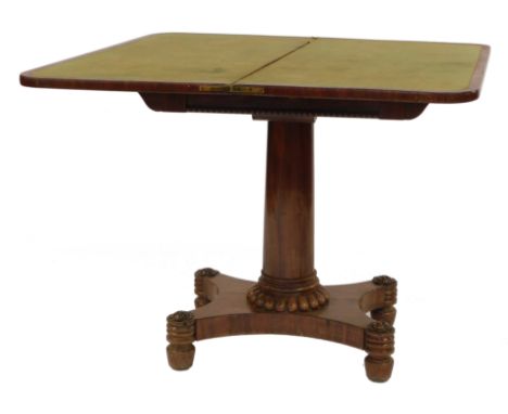 A Regency mahogany card table, the hinged top with a rounded edge enclosing a green baize interior, with a scroll and egg and