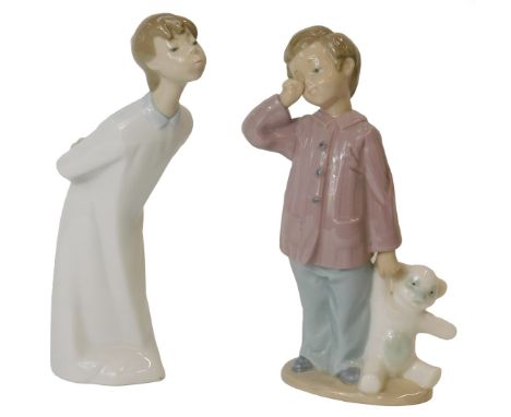 A Lladro porcelain figure modelled as a boy wearing a nightgown bowing, 21cm high, together with a Nao figure modelled as a y