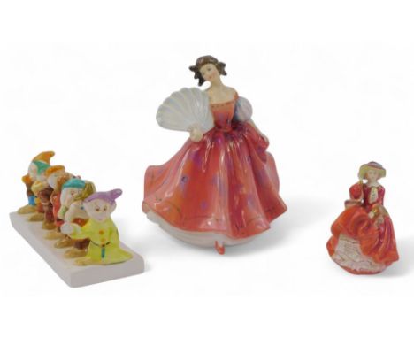 A Royal Doulton porcelain figure modelled as First Waltz, HN2862, (AF), together with a Royal Doulton Top of the Hill figure,