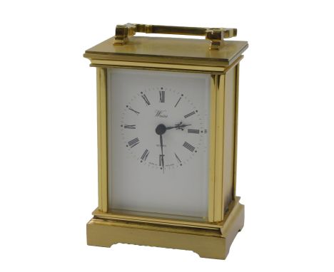 A 20thC brass cased carriage clock, the rectangular white enamel dial bearing Roman numerals, for Weiss, with a quartz moveme