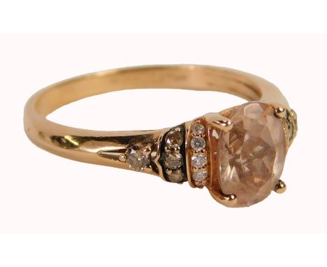 A Le Vian lady's rose gold morganite and diamond dress ring, the central oval morganite, with tiny diamond set stepped should