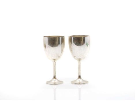 A pair of silver cups marked 925 Sterling, on weighted bases,16cm highCondition ReportTarnishing and light surface scratches 