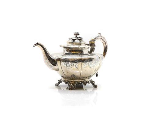 A Victorian silver teapot by William Hunter, London 1847, the finial modelled as a rose, the handle with ivory insulators, to