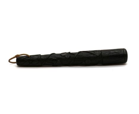 An Irish bog oak truncheon, 19th century, carved with entwined bands of shamrock, with cord wrist strap, 30.5cm long, togethe