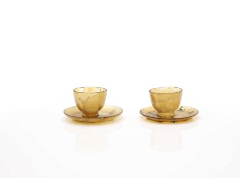 A pair of Chinese agate cups and saucers,  second half of 20th century, the rounded sides rising from a circular foot,  cup 5