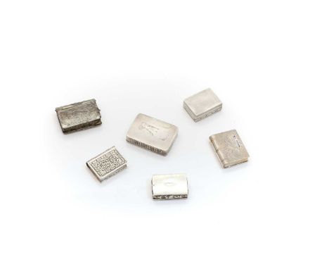 A group of silver snuff boxes and vesta cases comprising three examples modelled as books, including an example marked 'CAO 9
