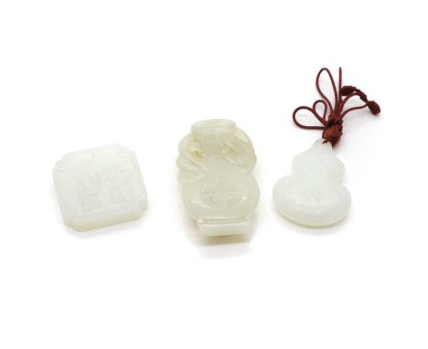 A group of three Chinese jade carvings,  20th century, comprising: a pendant,  in the shape of a double gourd, inscribed 'Da 