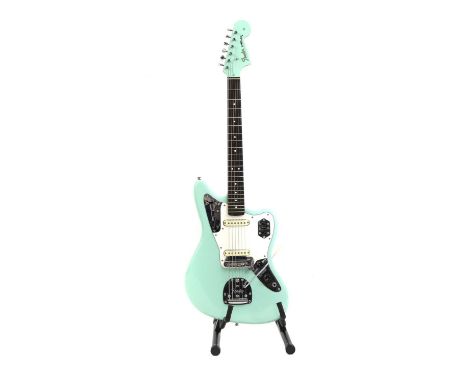 A Fender Jaguar electric guitar, possibly made in Japan, finished in seafoam green with matching headstock, equipped with a F