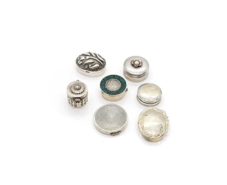 A group of seven silver boxes comprising a Mexican pill or tooth box, marked 925, with an Aztec style mask, to a green hardst