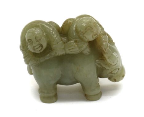 A Chinese jade carving, 20th century, of two boys bathing to a buffalo, 5.5cm longCondition ReportMinute chips and small crac