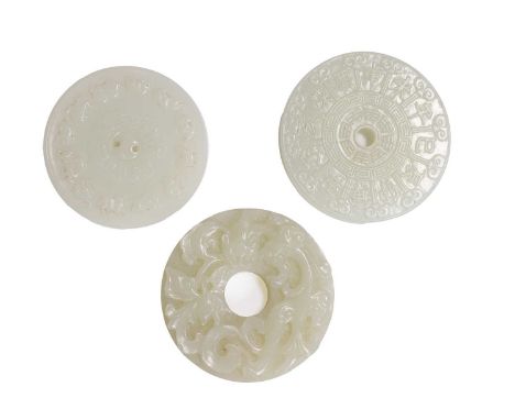 A group of three Chinese jade bi disc, 20th century, comprising:one carved with a chilong,clasping a peony branch with its mo