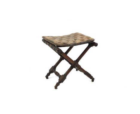 A mahogany folding luggage rack stool,  with a button seat pad, turned cross legs, terminating in bun feet, 51cm wide47.5cm d