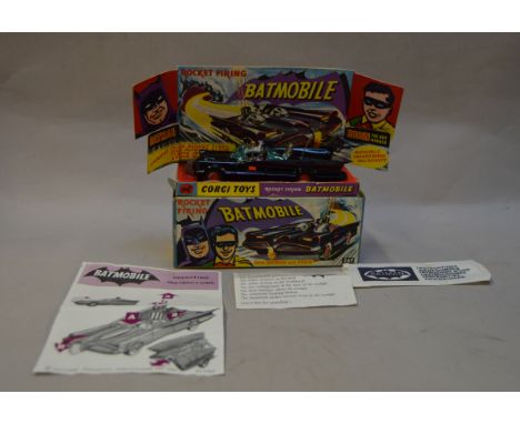 Corgi 267 Batman Batmobile with black body, blue tinted windows, red bat hubs, grey plastic aerial and Batman and Robin figur