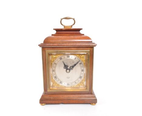 Garrard &amp; Co Ltd - A 20th Century circa 1980s mahogany Garrard &amp; Co Ltd Elliott bracket clock. The clock having brass