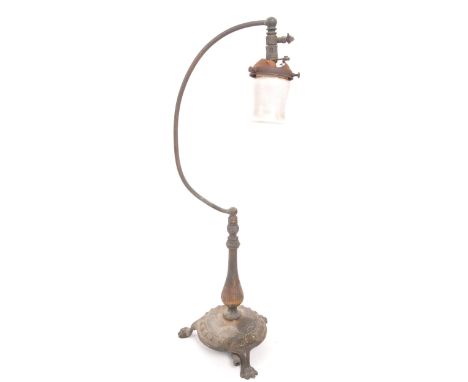 Early 20th century free standing table gas lamp. Brass base with paw feet, curved arm with air flow fitting and white shade. 