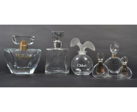 A group of vintage 20th century advertising point of sale shop display perfume bottles to include Chloe Karl Lagerfeld 1975 ,