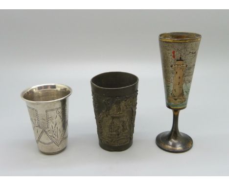 A Russian silver vodka tot and two others 