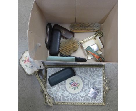 A gilt metal and glass dressing table set, six pairs of vintage spectacles and two lighters 