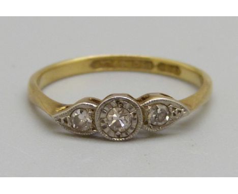 An 18ct gold, platinum set three stone diamond ring, 1.7g, K 