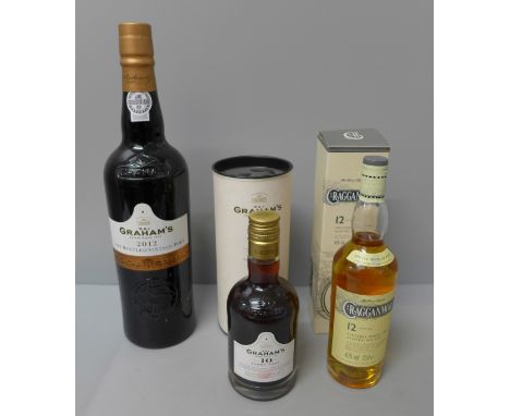 Two bottles of Grahams port and a bottle of Cragganmore Scotch whiskey 