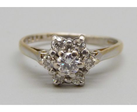 An 18ct gold and diamond cluster ring, 3g, M 