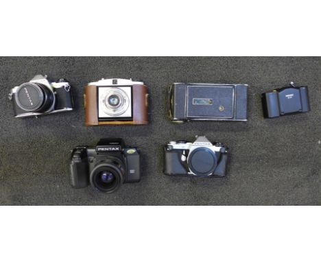 A collection of cameras; Pentax SFX, Minox 35GT, Agfa folding and others 