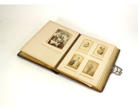 A Victorian photograph album by T.J.S.S. and D., the themed plates decorated with the flowers of the forest, accommodating ov