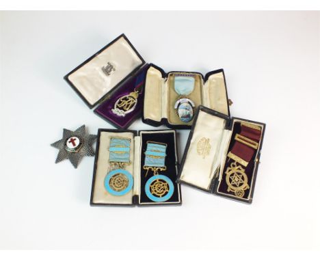 A collection of Masonic Regalia, to include; badges, aprons, caps, rosettes, a pewter tankard, a 14ct gold jewel, a 15ct gold
