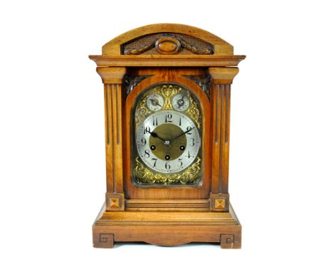 A Victorian walnut cased bracket clock, the silvered dial with black Arabic numerals, with two subsidiary dials encircled by 