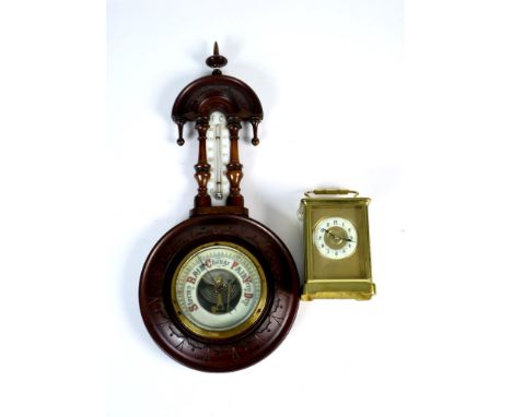 A small early 20th century continental brass cased carriage clock, the white porcelain dial with black Arabic numerals, set w