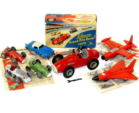 Schuco group of 1950s clockwork toys: Schuco clockwork Grand Prix Racer 1070 (“Made in US Zone, Germany”) red tinplate clockw