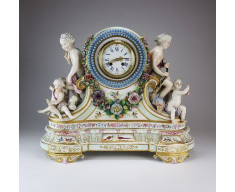 A large and ornate French porcelain mantel clock, late 19 th century with 4” white enamel dial and blue Roman numerals, 8-day