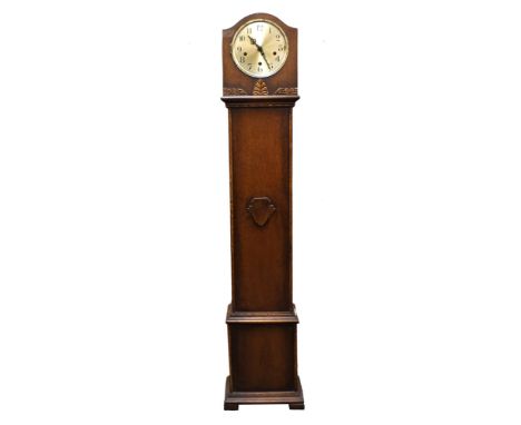 An early 20 th century stained oak cased ‘grandmother’ small longcase clock, the silvered dial (7” diameter) with black Arabi