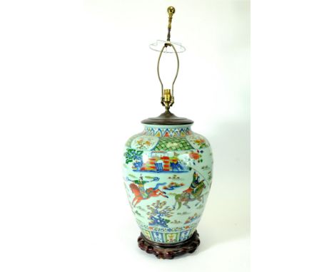 A large Chinese porcelain vase lamp of tapering baluster form, decorated in the Doucai manner, decorated with warriors on hor