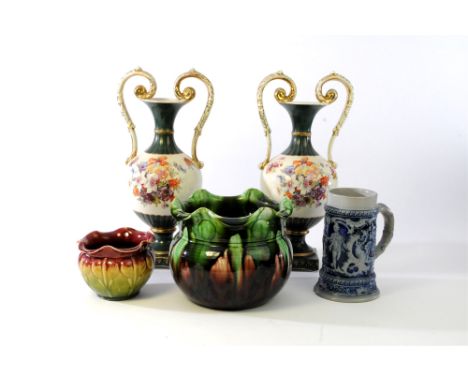 An Art Nouveau jardiniere by W F Needham in the 'Veronique' pattern in red and green glaze, together with three further simil